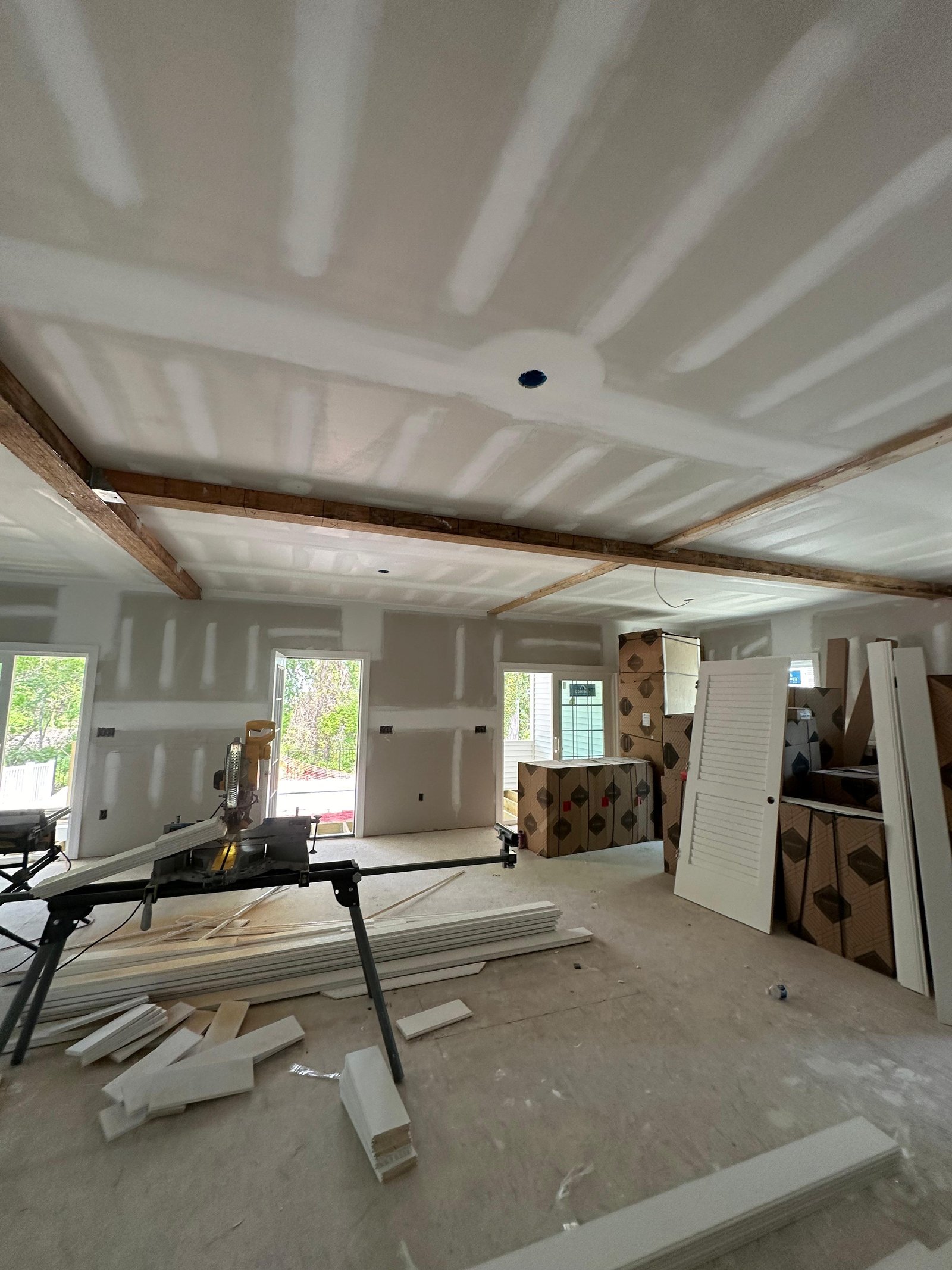Great room during ceiling and wall finish construction